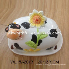 Hand painted cow shaped ceramic bread plate with flower